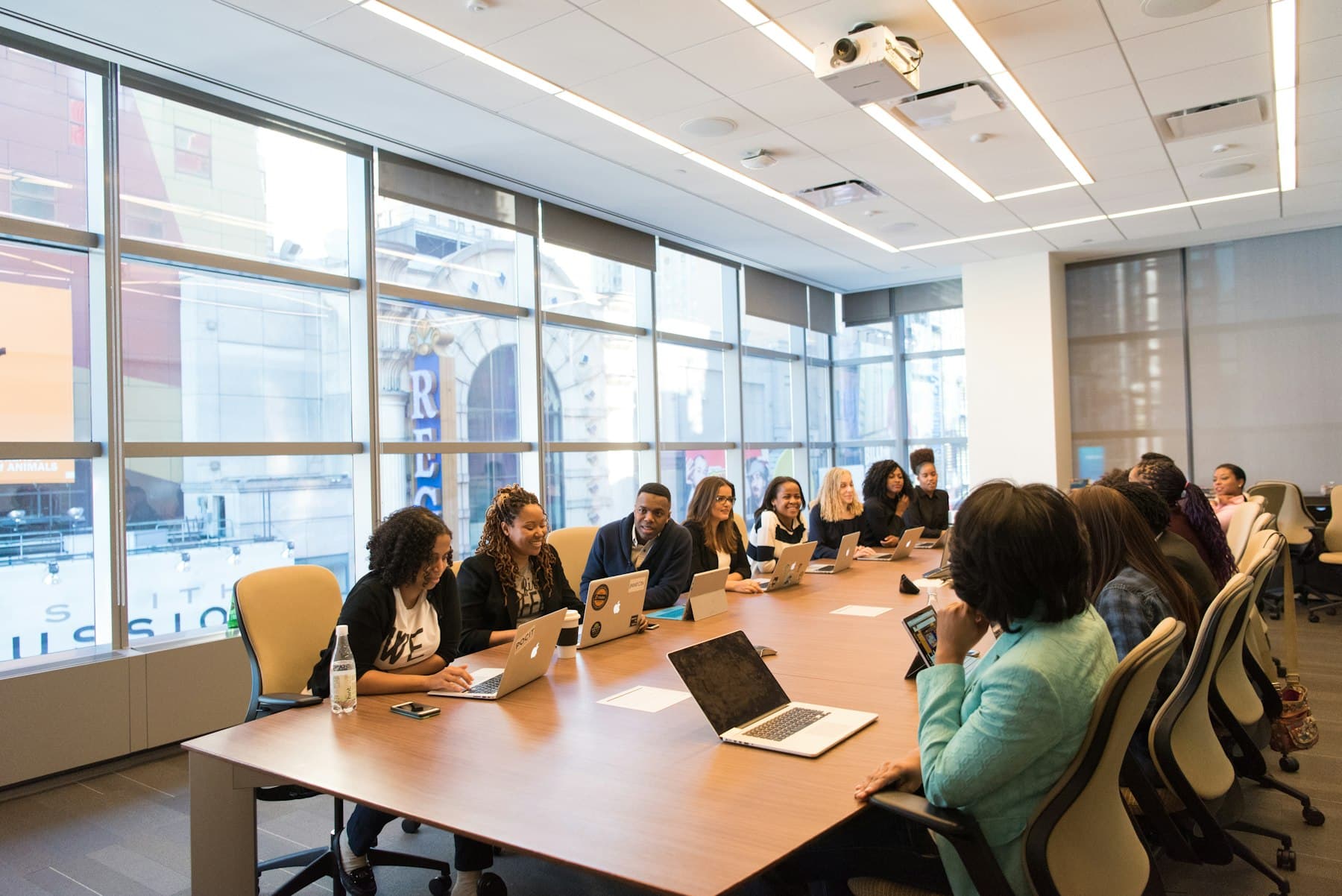 HR professionals in a working session around a boardroom table